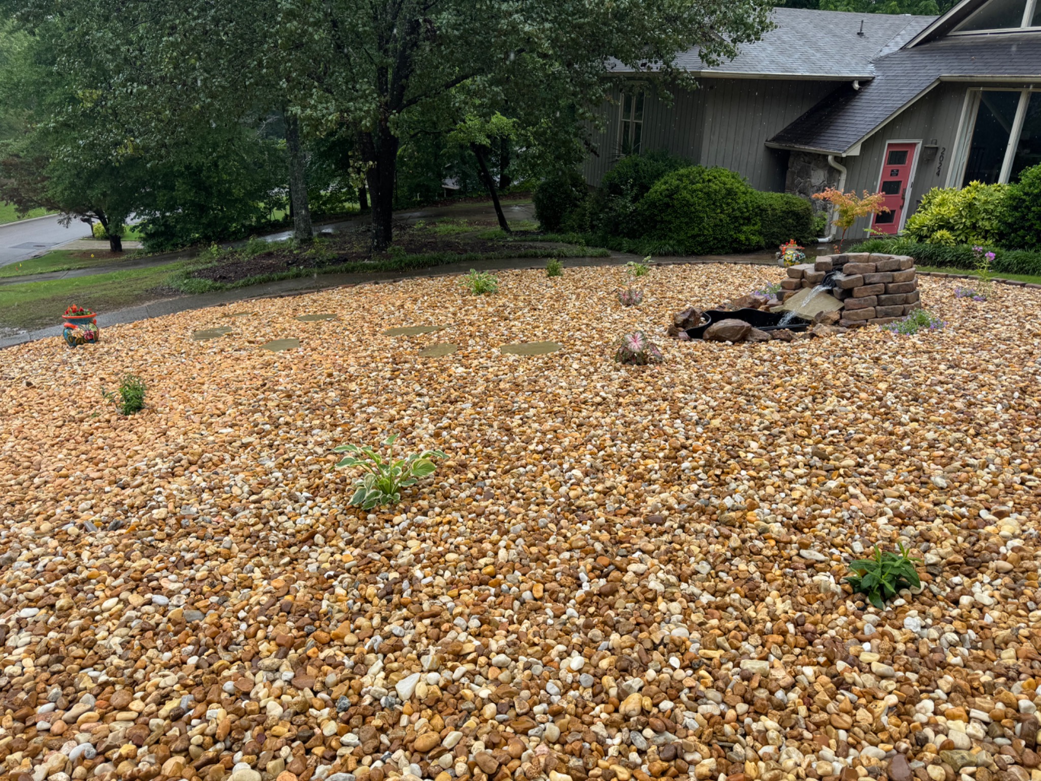 Finished hardscape and landscape project with water feature